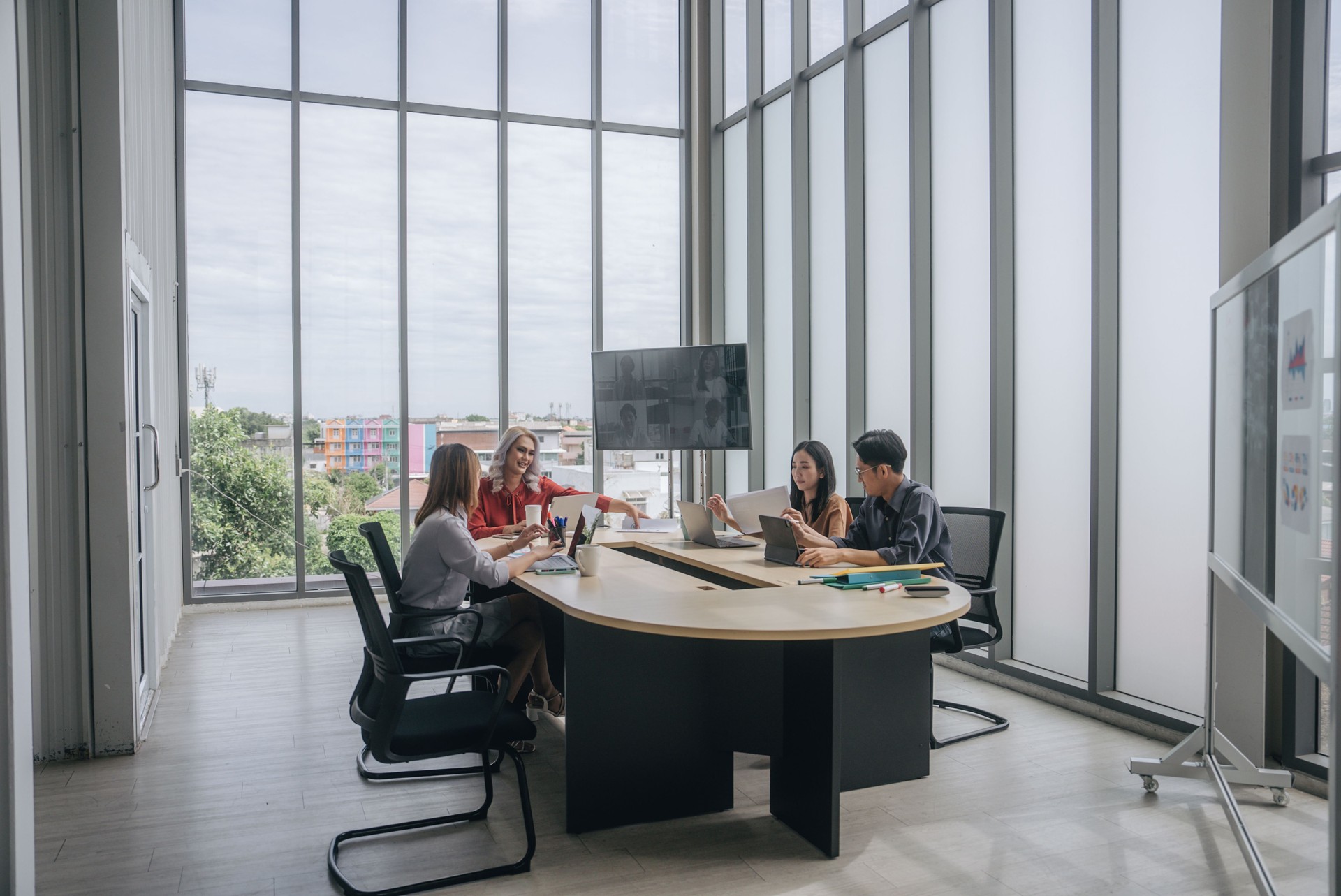 Group of business people having a meeting at their modern company.